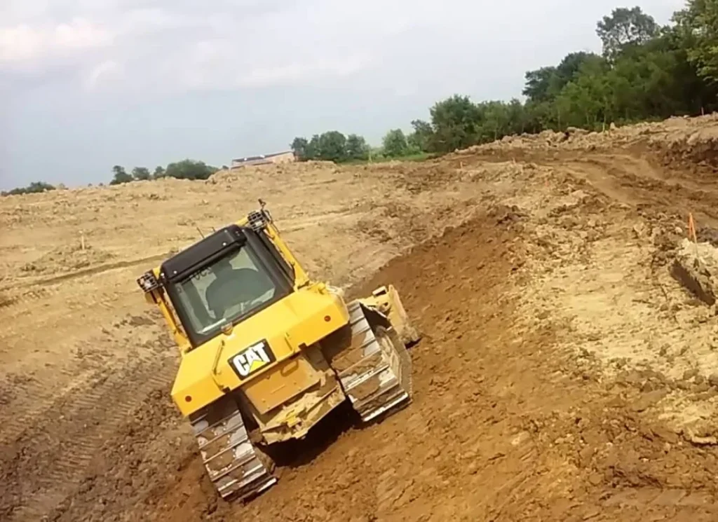 Bulldozer grading land
