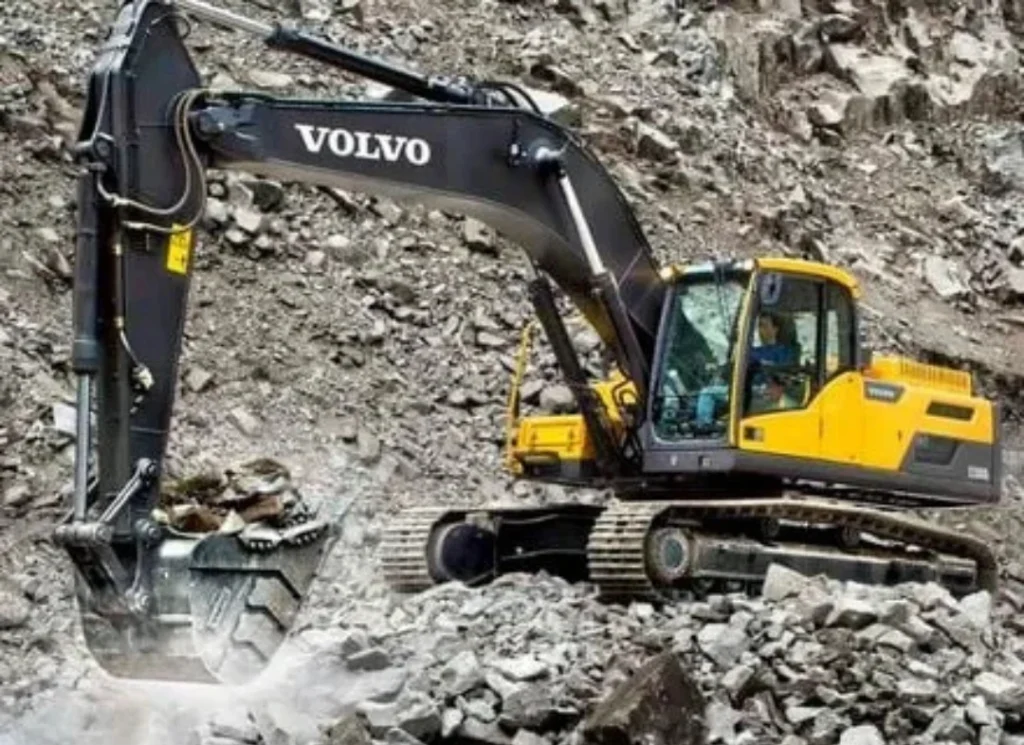 Excavator breaking rock
